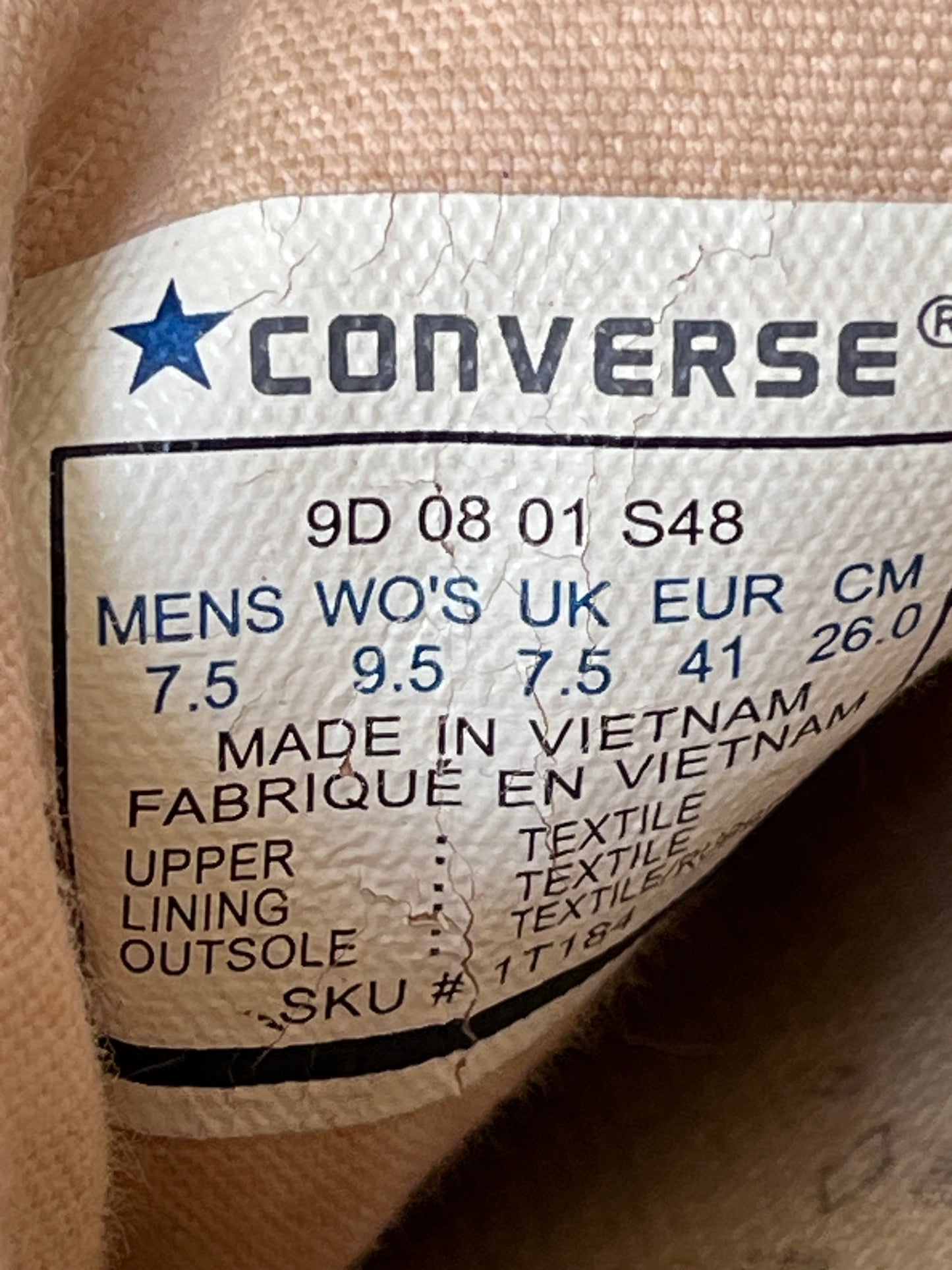 Dark brown lowtop converse