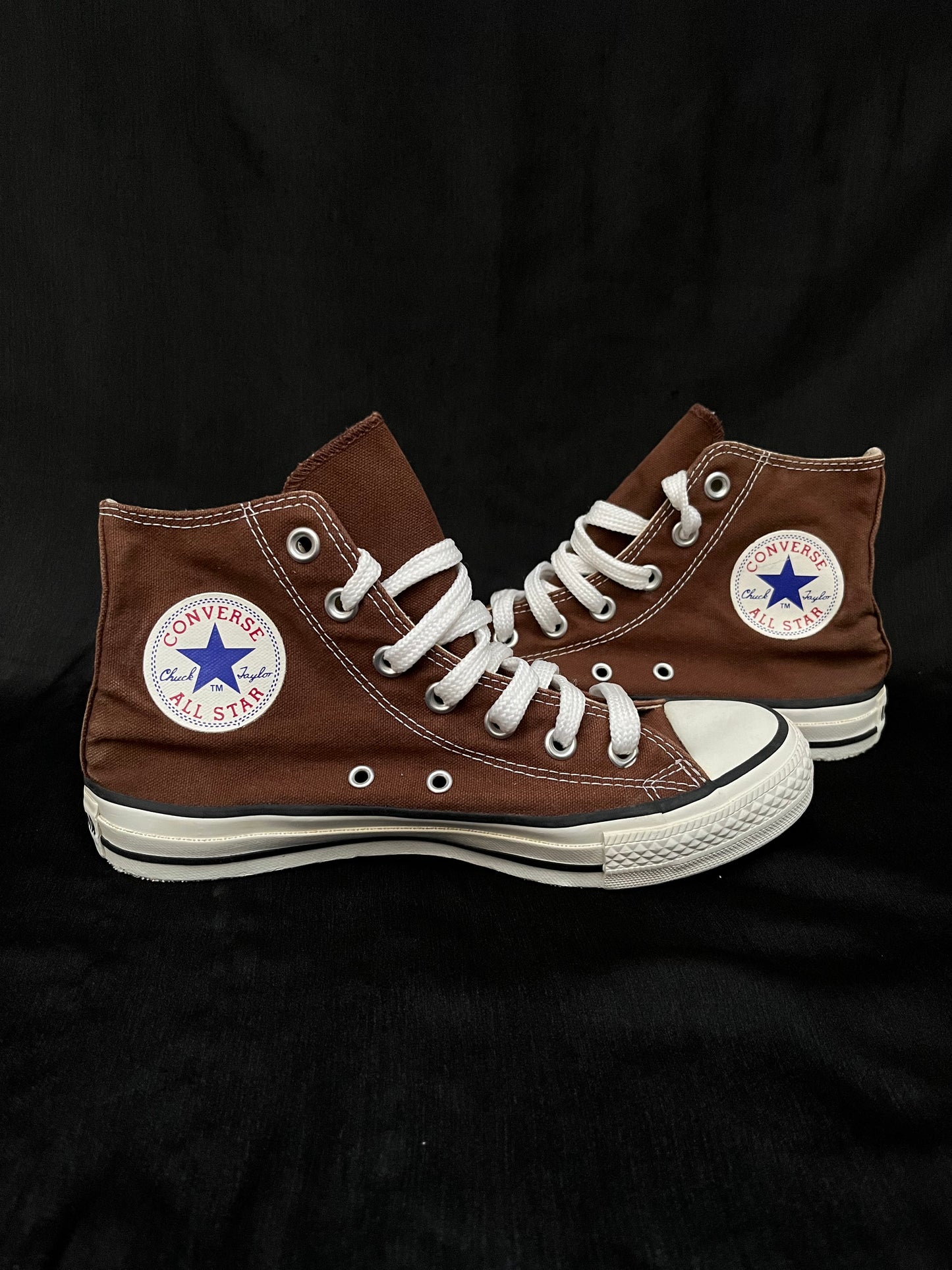 Brown hightop converse