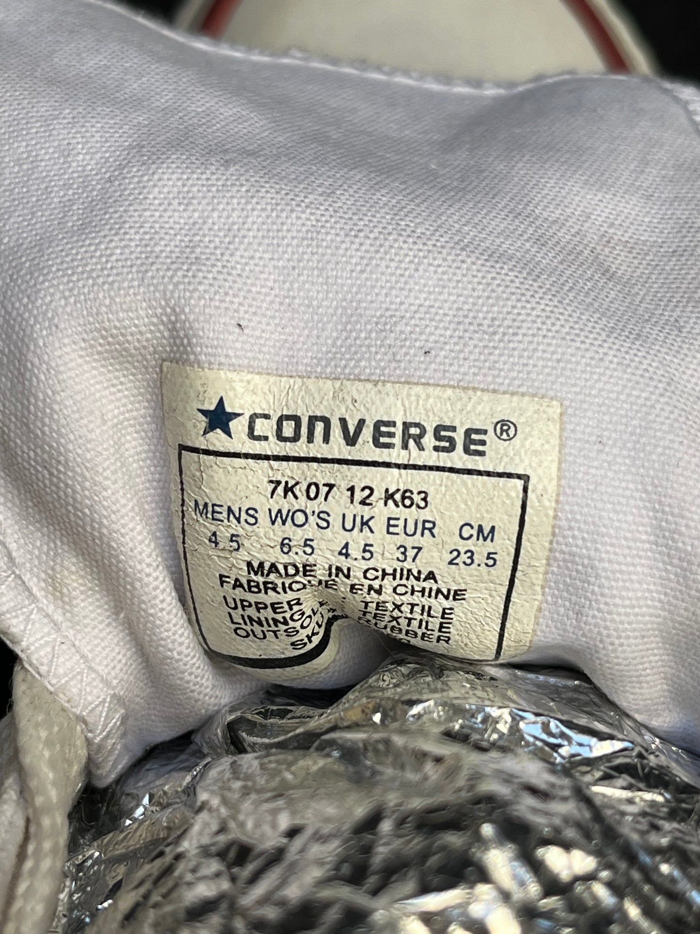 White hightop converse