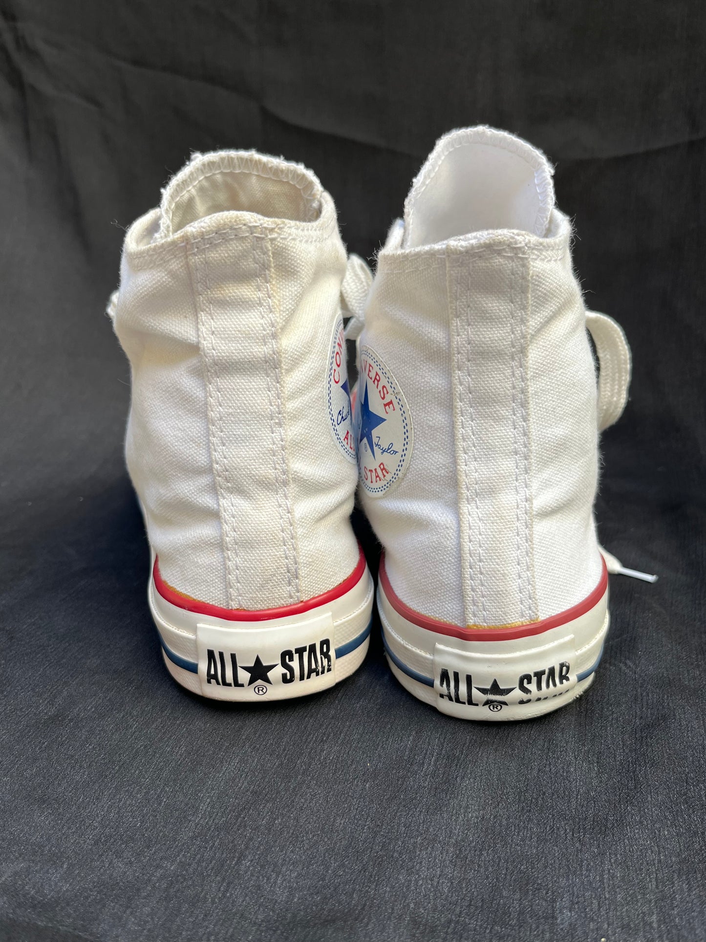 White hightop converse
