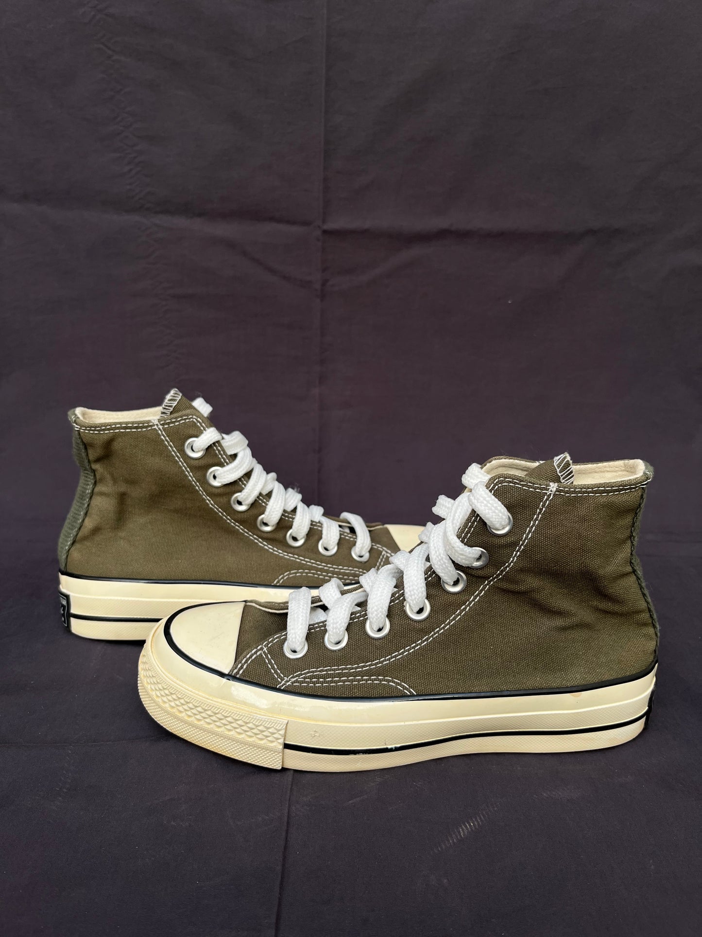Olive green Chuck Taylor hightop